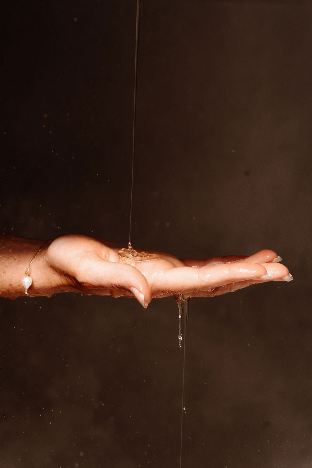 Liquid pour over hand of The Lube – Coconut, water-based personal lubricant by We Are Human